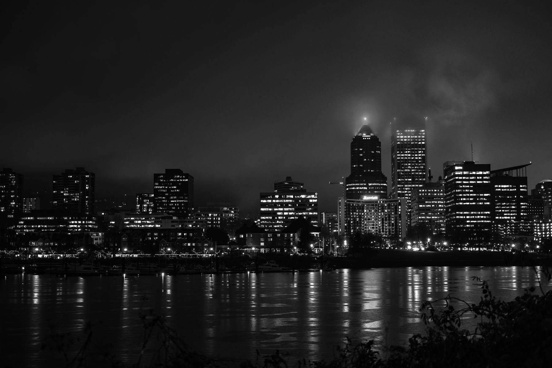 Black and white Portland skyline shot across the river.